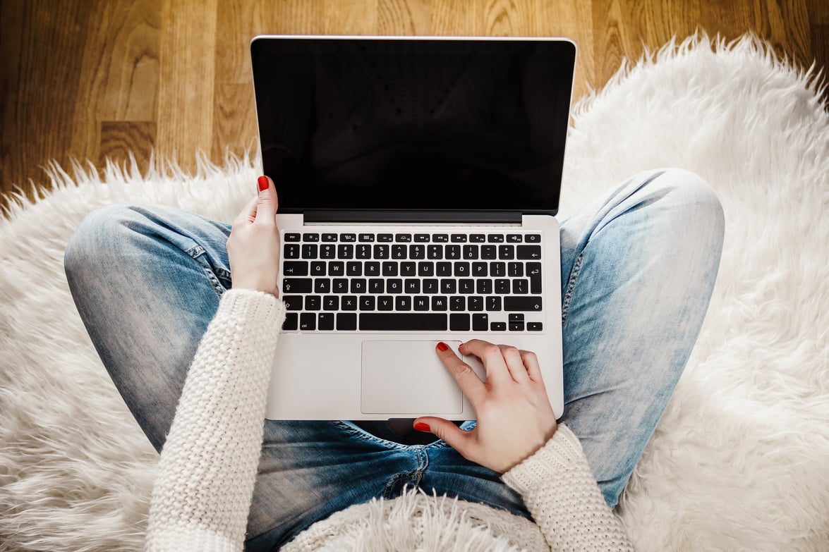 Woman Holding a Computer on Her Lap